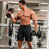 image:imageCOOFANDY Mens Athletic Shorts 7 Inch Quick Dry Stretch Lightweight Gym Workout Shorts with PocketsBlack StripesBlack